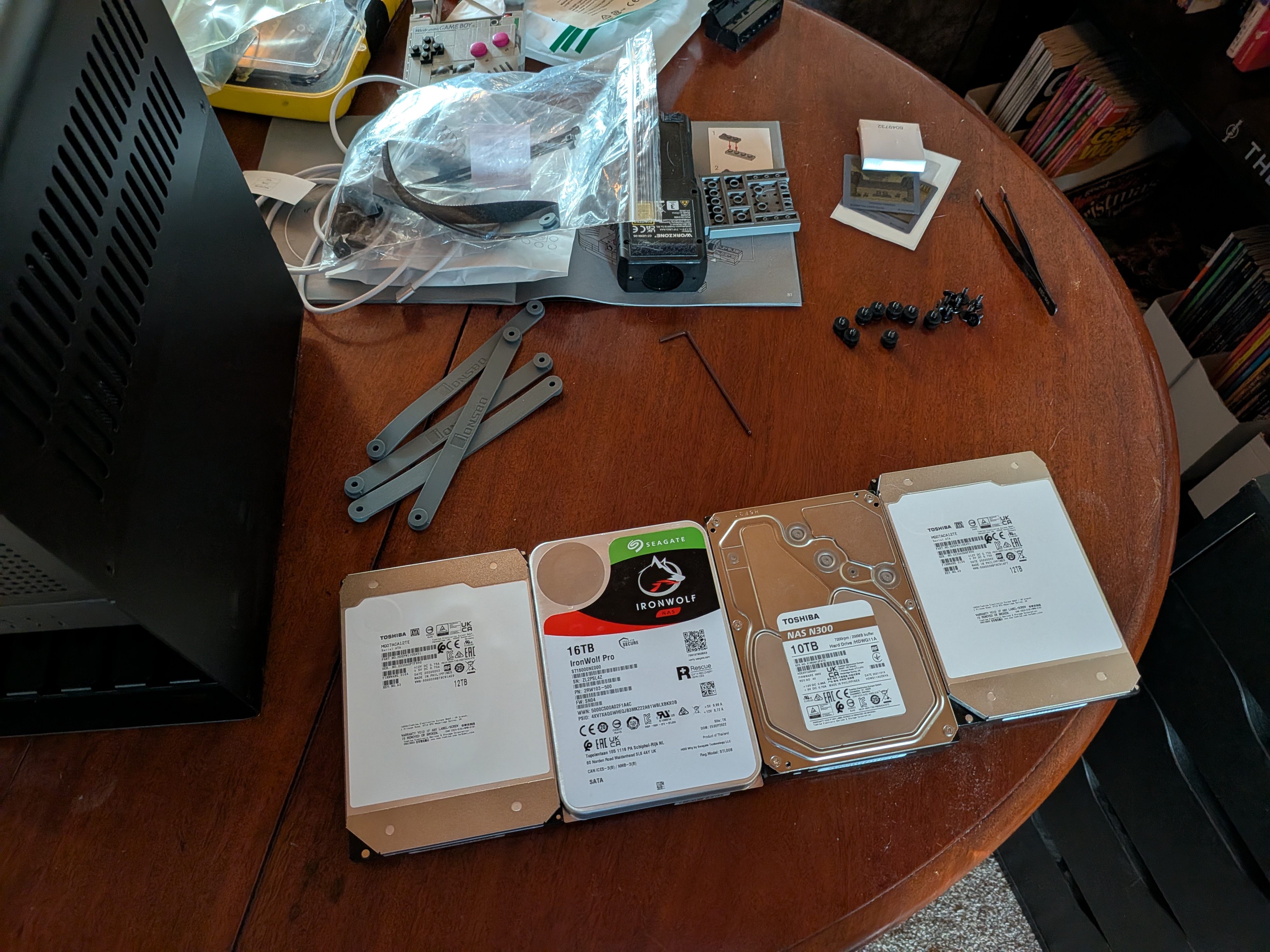 Four bare drives laid out on a table